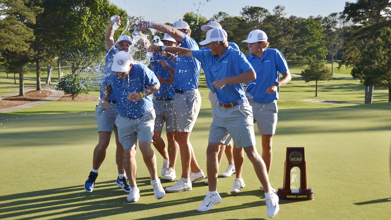 UNG men's golf players douse head coach Bryson Worley with water after the team's dominant NCAA Division II South/Southeast Regional championship win at Chattahoochee Golf Club in Gainesville, Georgia. 